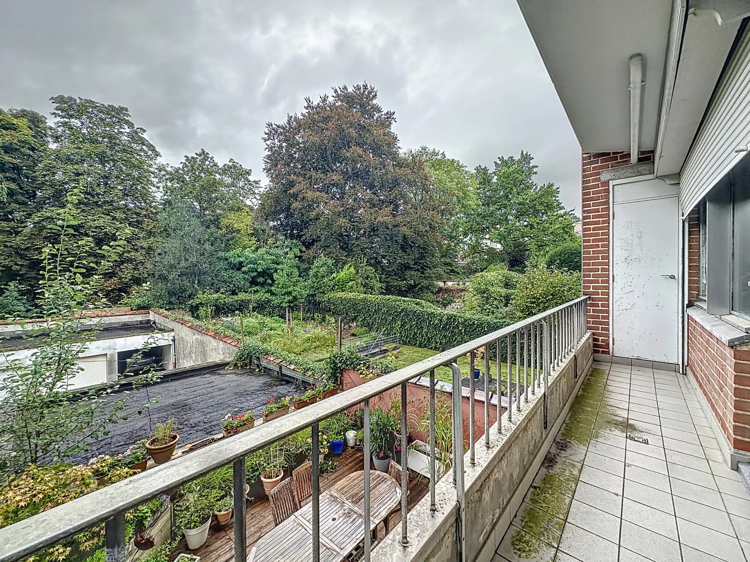 Tranquil green balcony under cloudy skies Balcony - Superb 2 bedroom apartment, terraces & garage - Brugmann - Uccle