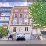 Elegant apartment with stone and brick facade, urban gardens, plenty of natural light, modern parking.