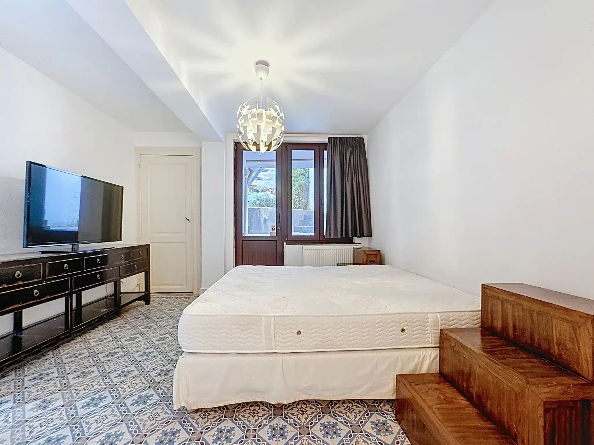 Moderne en gezellige kamer met elegant ontwerp Slaapkamer - Licht duplex met tuin - Sint-Gillis