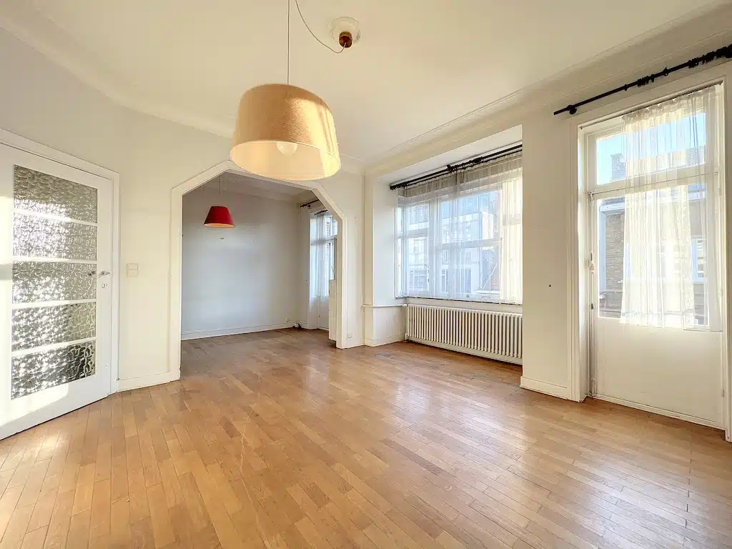 Bright Living Room with Large Windows and Minimalist Leaves Living room - Forest - 2-bedroom apartment with terrace