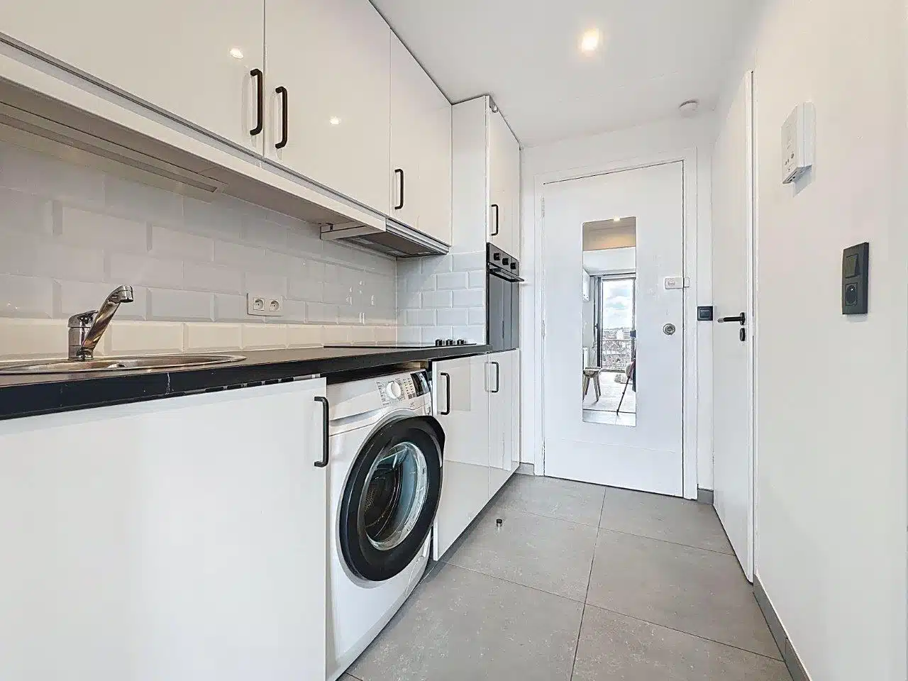 Bright, modern corridor kitchen - You Real Estate Agency Modern, bright corridor kitchen with built-in storage in an apartment.