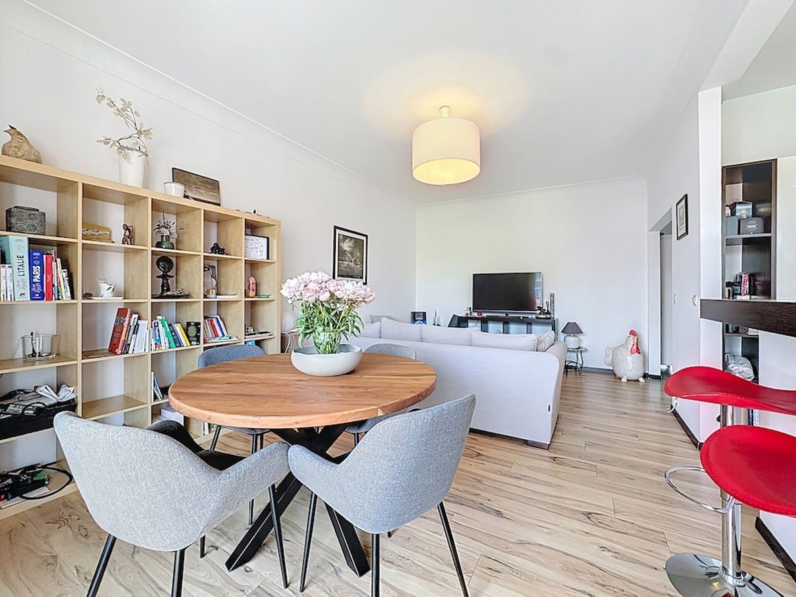 Bright living-dining room - You Real Estate Agency Bright apartment with an open-concept living and dining area, hardwood floors, and modern furniture.