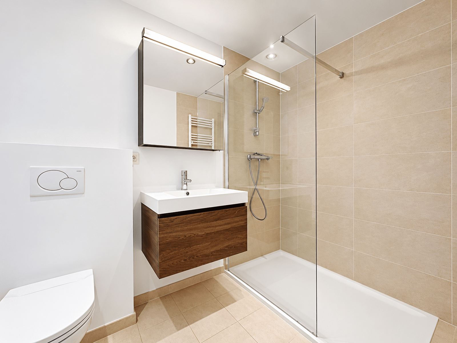 whise photo 11 Modern bathroom with a glass shower enclosure, beige tile walls, and a wall-mounted wooden vanity with a white sink.